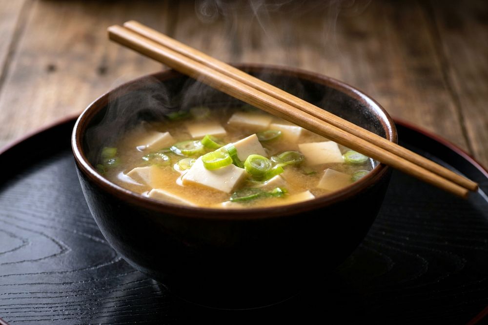 Bowl of miso soup with tofu and spring onion
