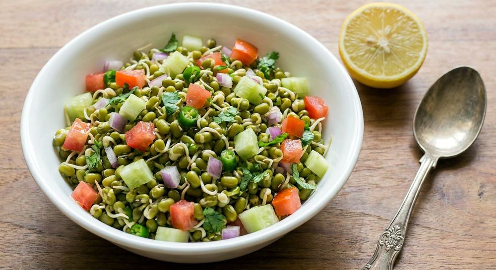 Fresh sprouted moong salad with tomato and cucumber